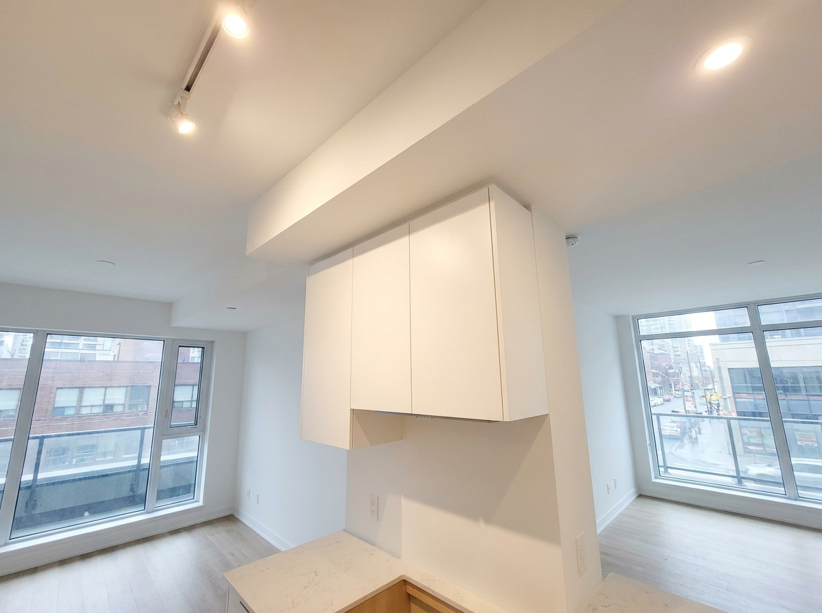 Upper cabinets - clean white finish reflects light and brightens the whole room